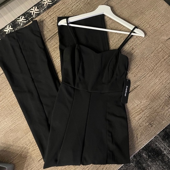 Bebe Open Leg Scuba Jumpsuit in Black. - Picture 6 of 9